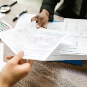 two people holding a piece of paper