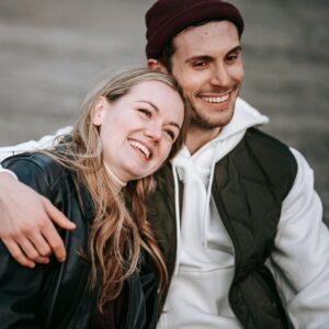 a man and woman smiling for a picture